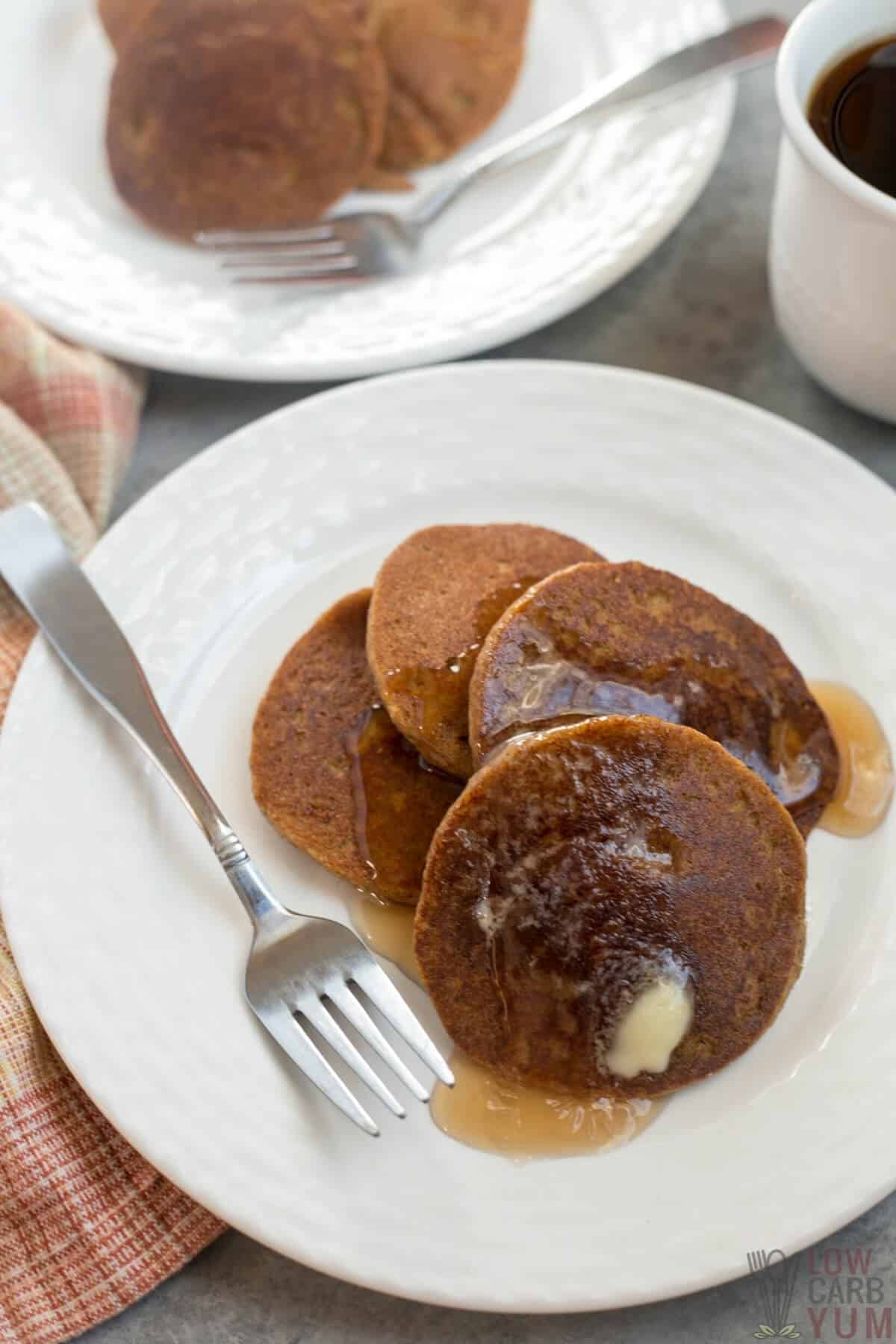 serving the low-carb pancakes with syrup and butter
