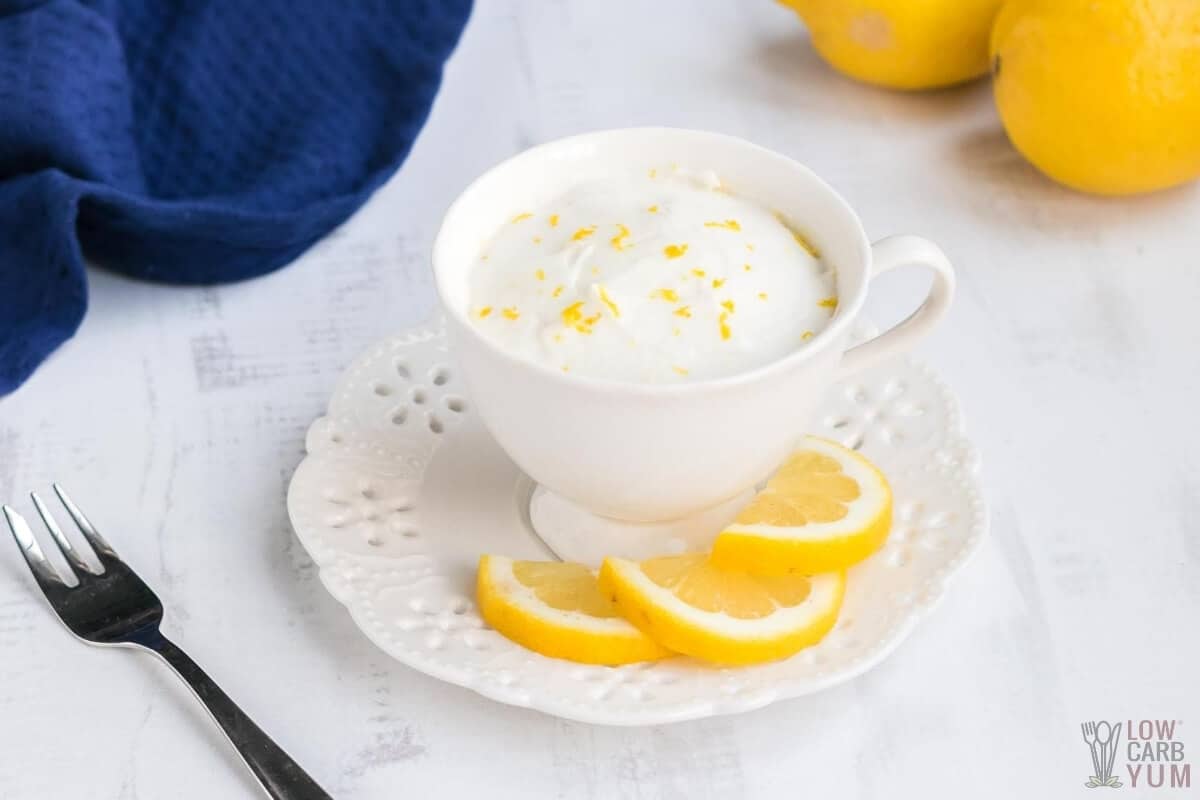 frosted lemon mug cake in cup