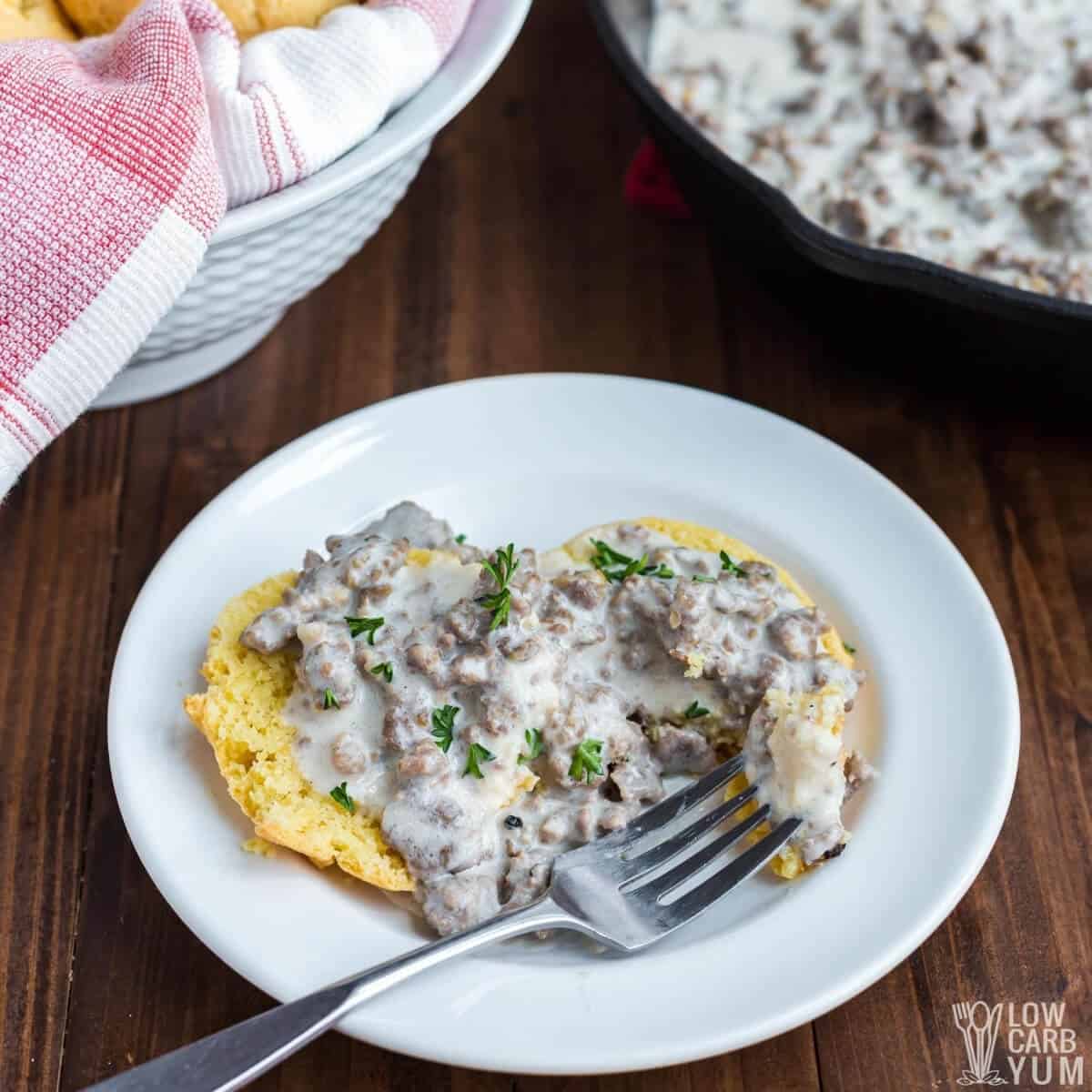 fork bite shot of biscuit with sausage gravy