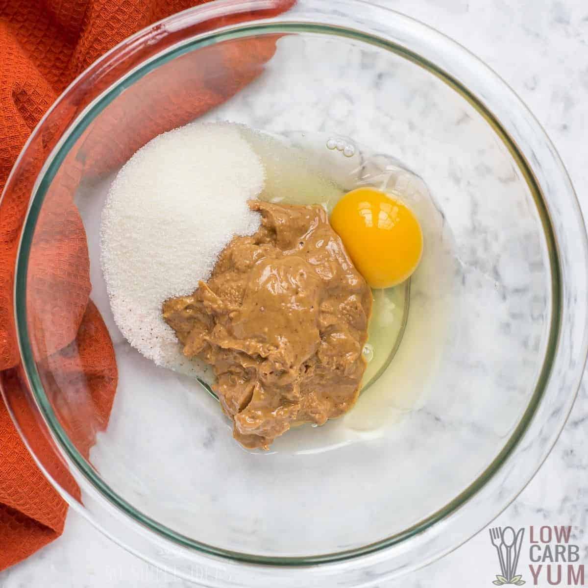 initial peanut butter cookie dough batter ingredients in glass mixing bowl.