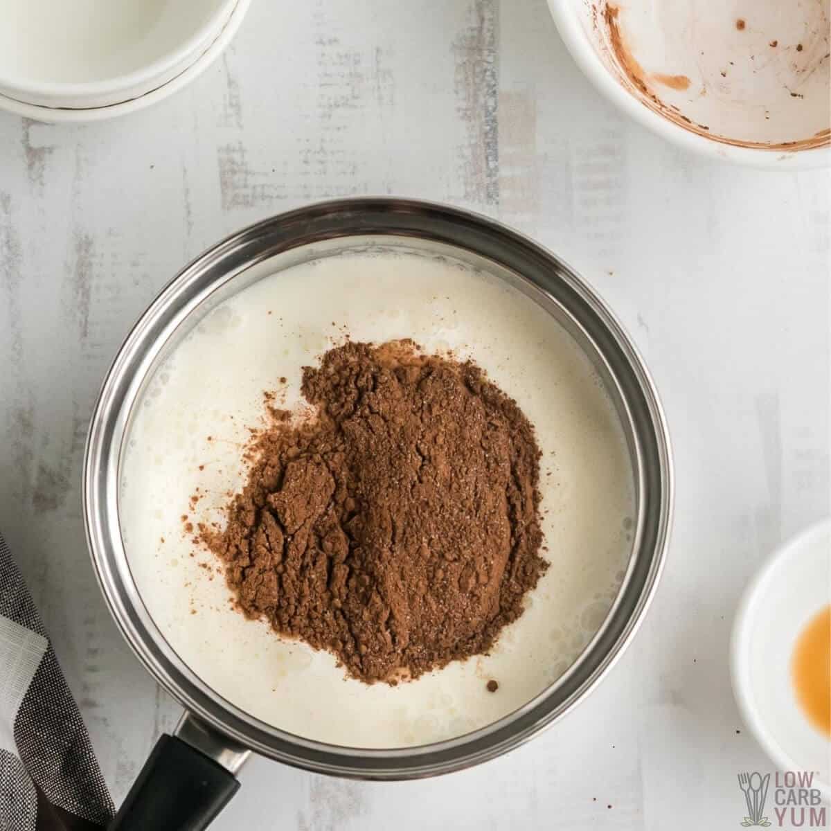 sweetener and cocoa added to water and cream in pot