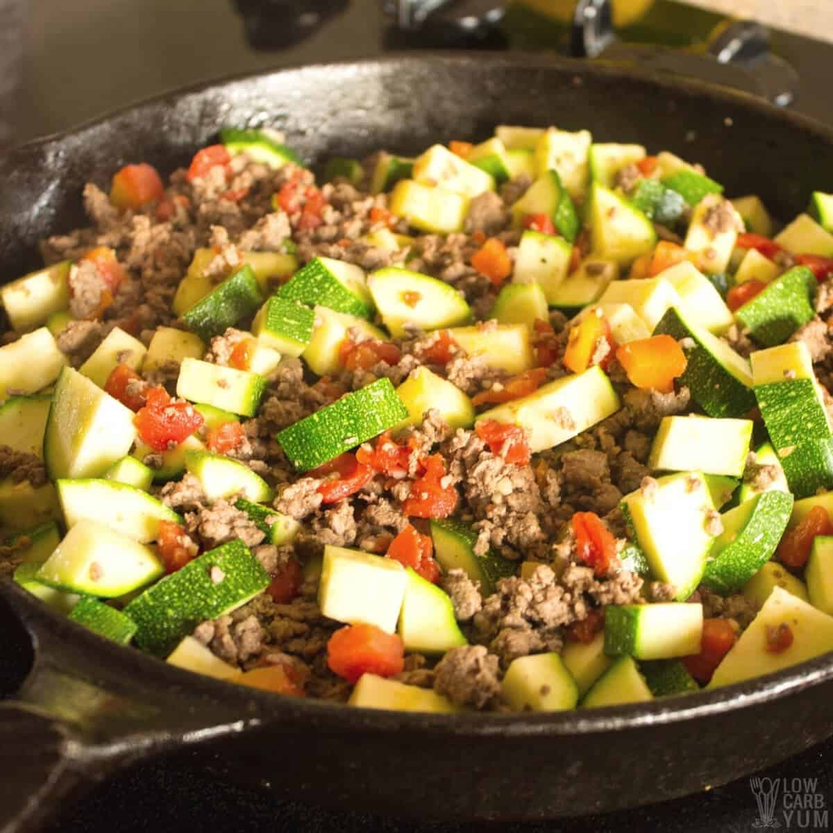 ground beef with zucchini in skillet