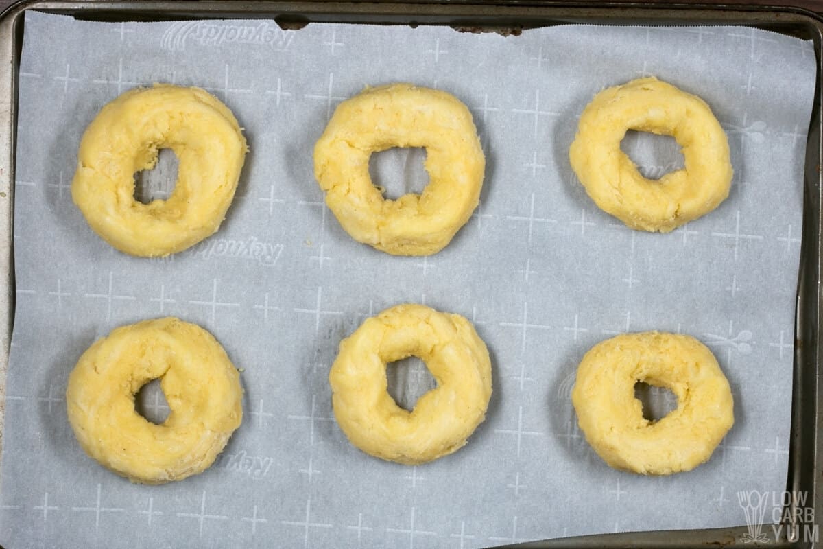 coconut flour dough in bagel shapes on lined pan