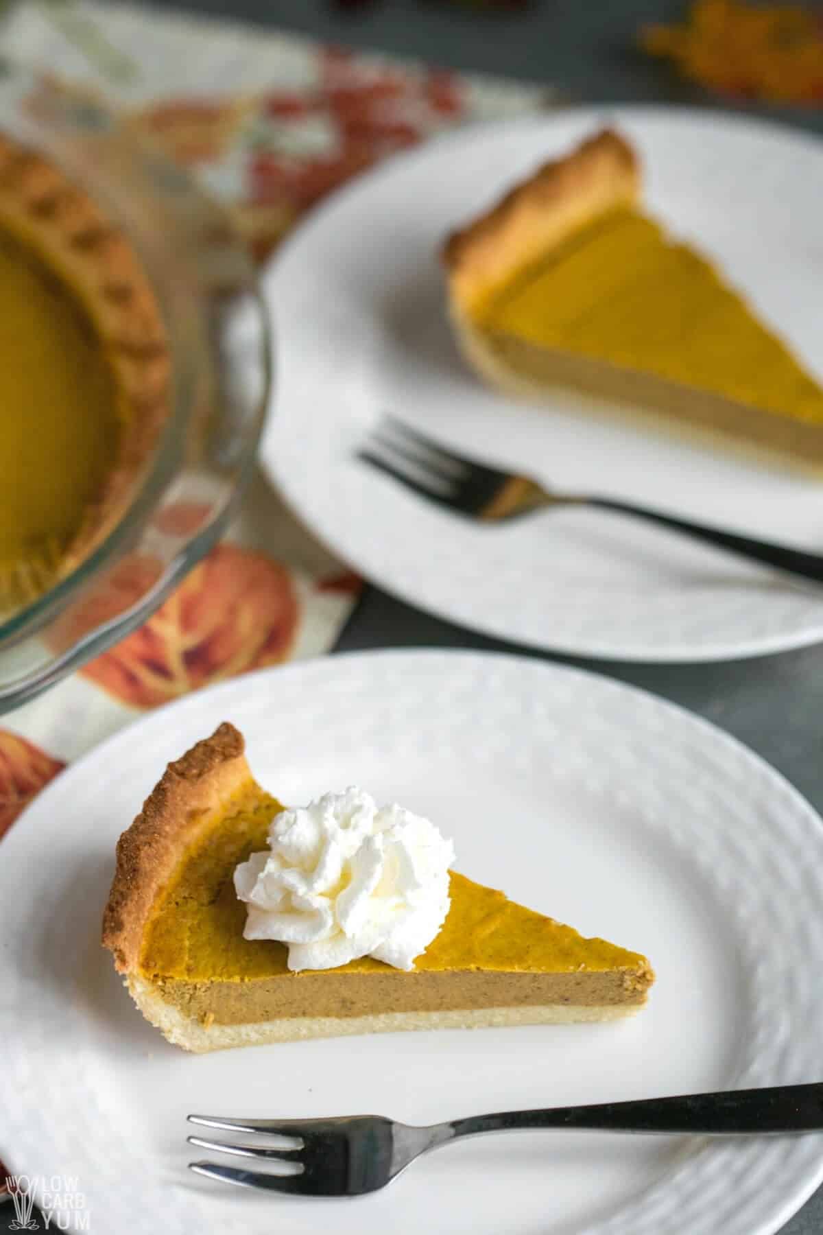 two slices of keto pumpkin pie on plates