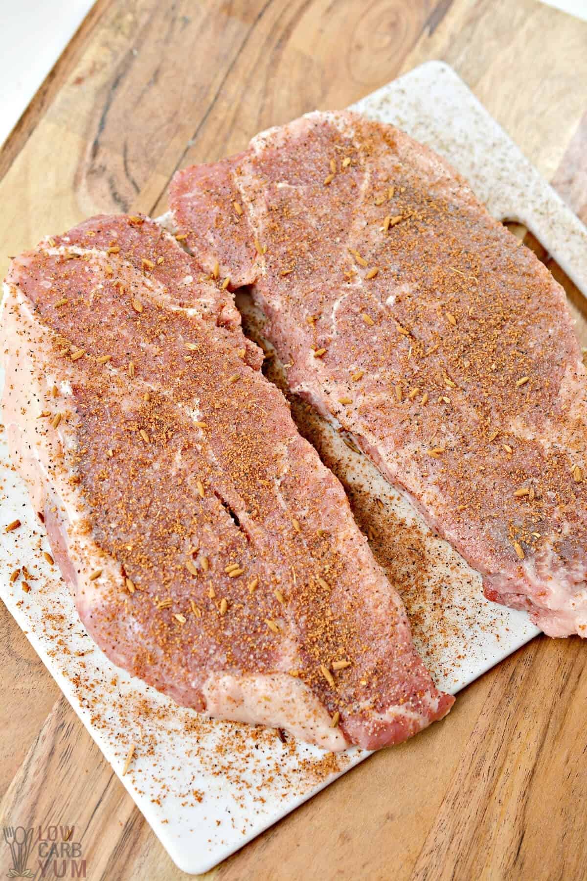 seasoned steaks on board