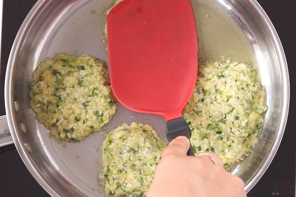 flattening batter in pan with spatula