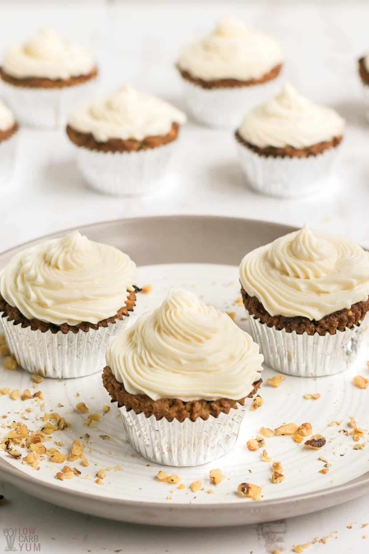 zucchini spice cake cupcakes with cream cheese frosting and walnuts