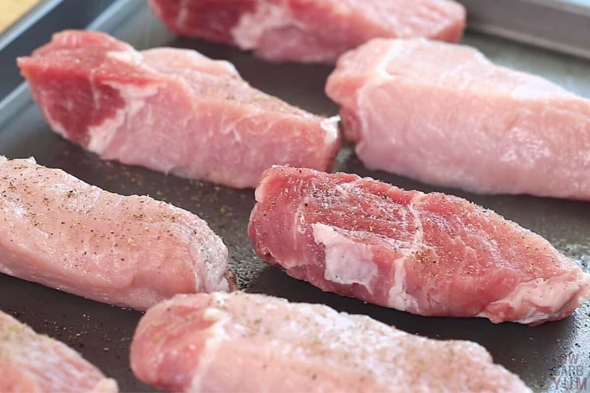 raw boneless pork ribs seasoned with salt and pepper