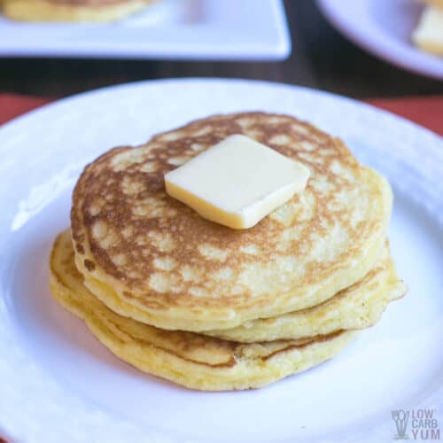 small stack of coconut flour pancakes topped with butter