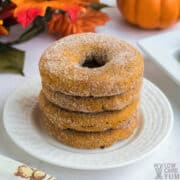 stack of keto pumpkin donuts on round white plate