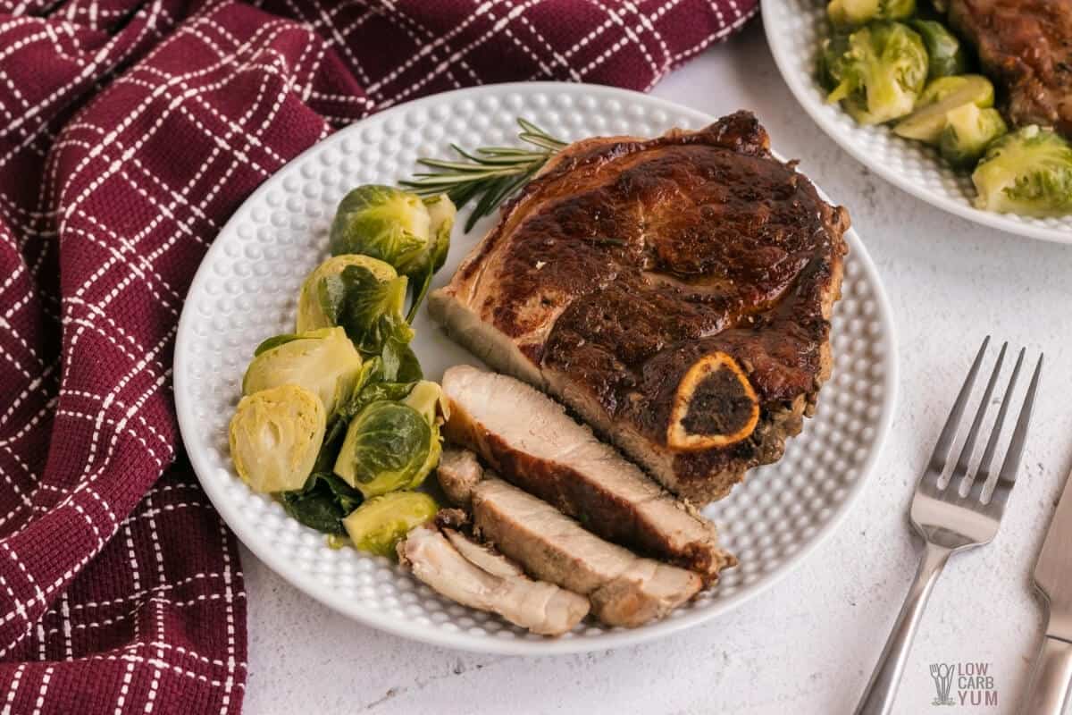 cooked pork chops sliced on plate