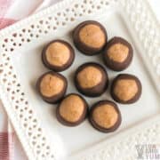 peanut butter balls buckeyes on white square plate