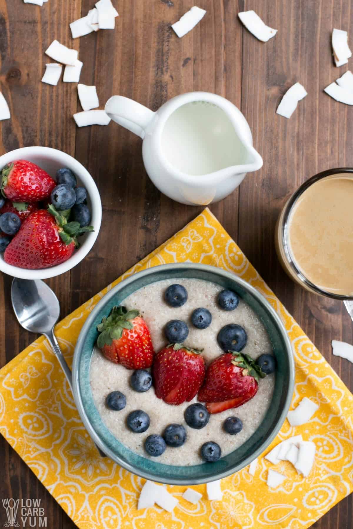 overhead view of porridge topped with berries in bowl