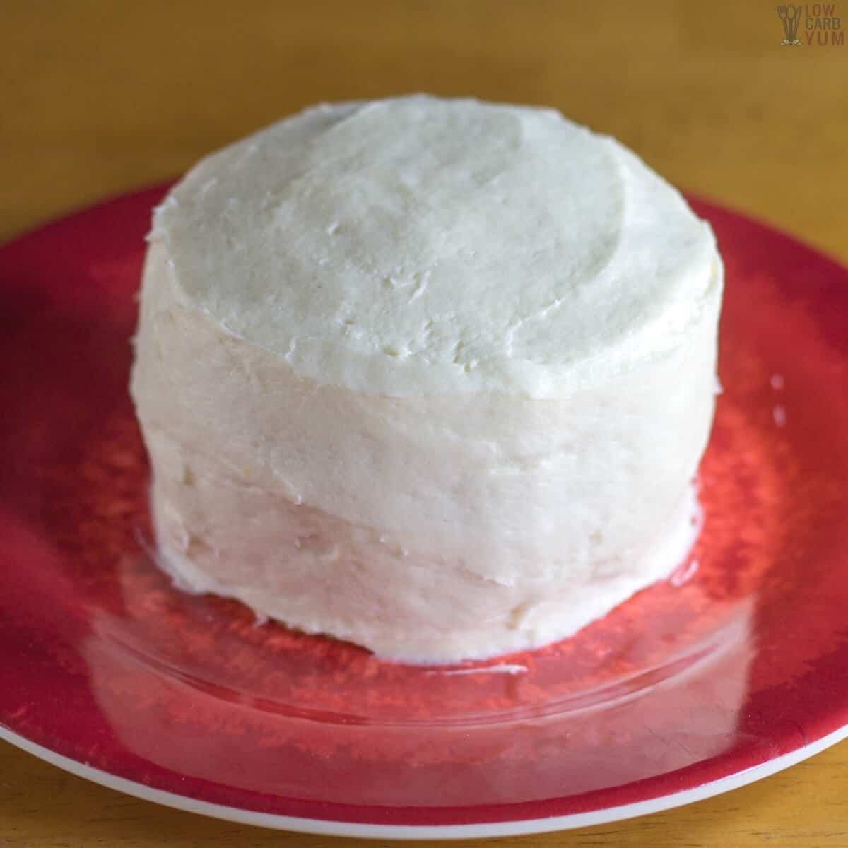 frosted layered mug cake on red plate