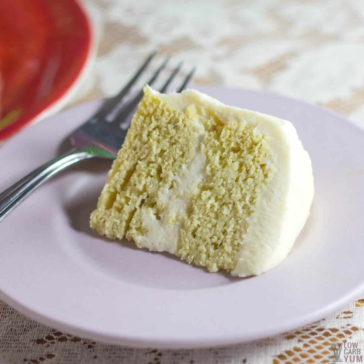 slice of keto birthday cake on lavender plate