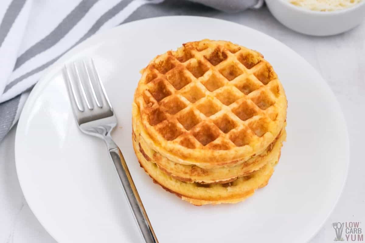 stack of chaffles on white plate with fork