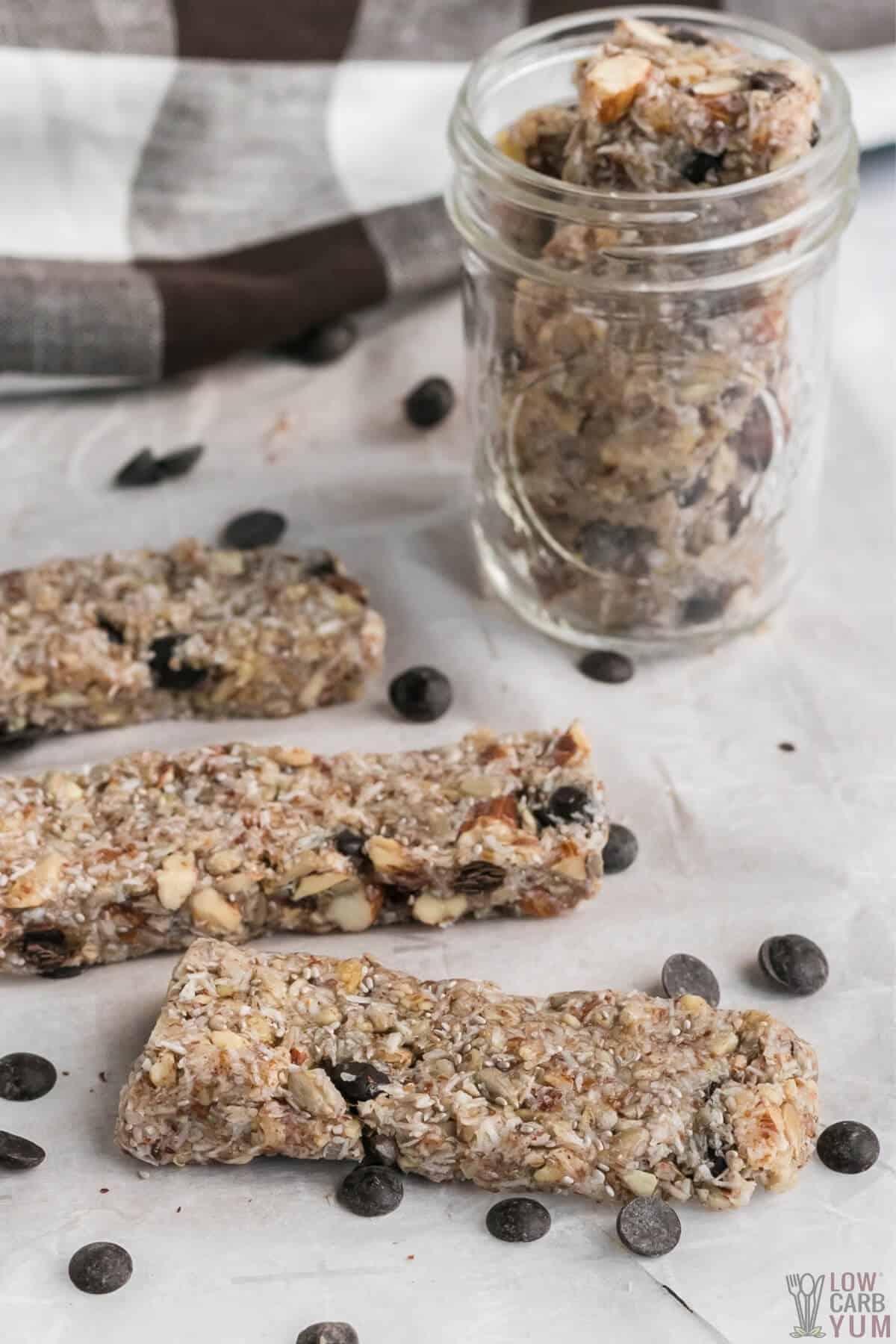 keto friendly granola bars on parchment paper and in mason jar