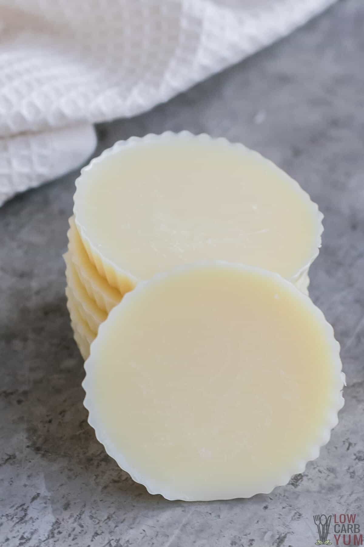 keto white chocolate fat bombs stacked up with one in front