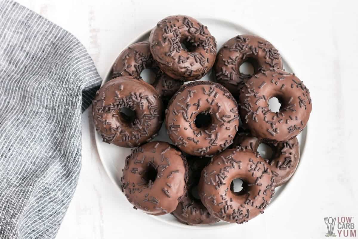 large plate of glazed double chocolate donuts