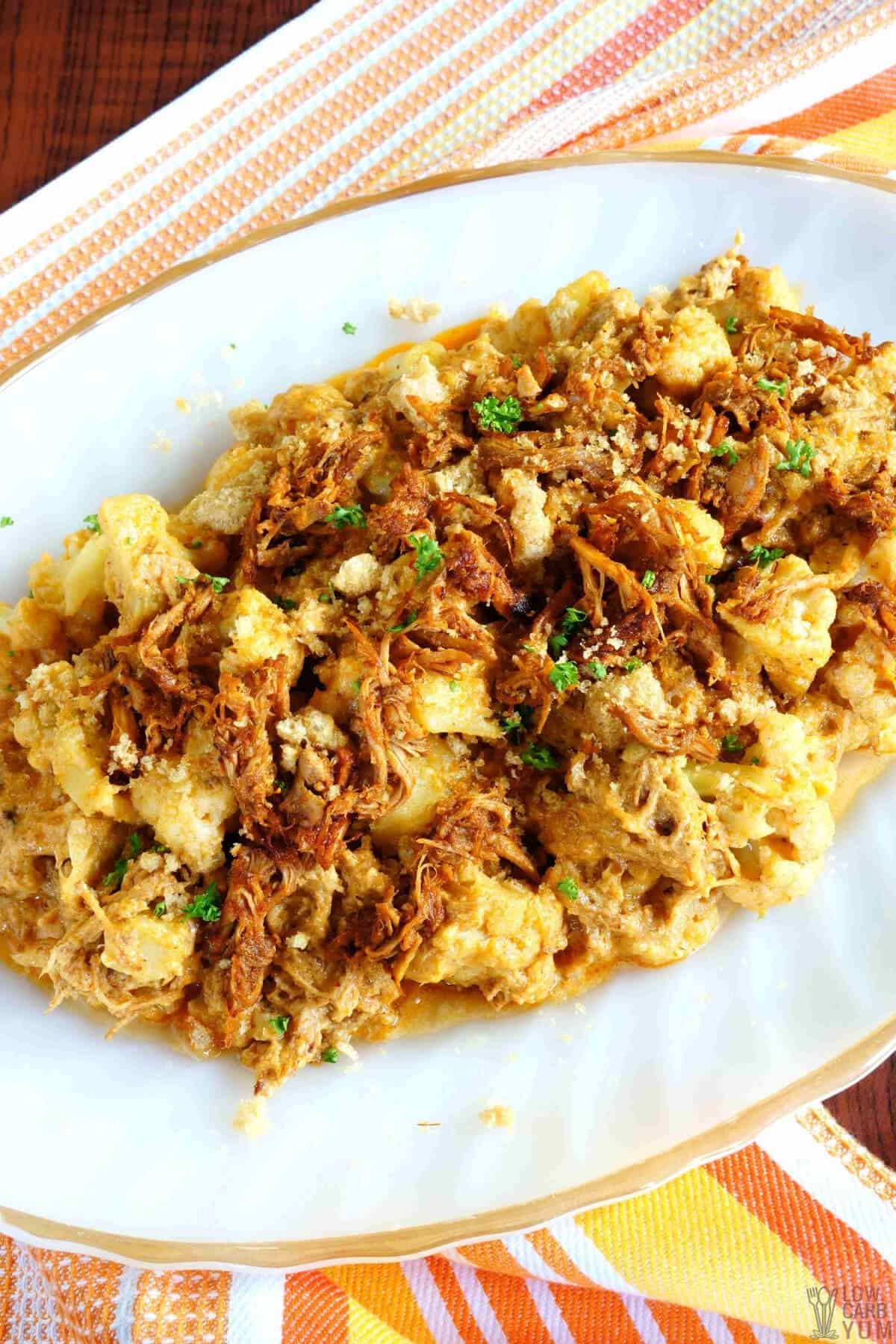 keto pulled pork mac and cheese with pork rinds on platter