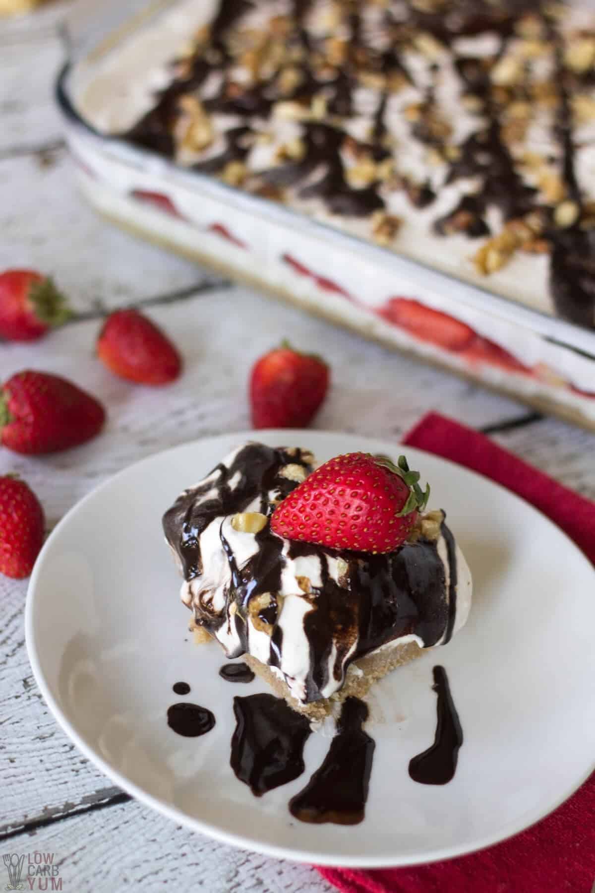 no bake banana split cheesecake in pan with slice on plate