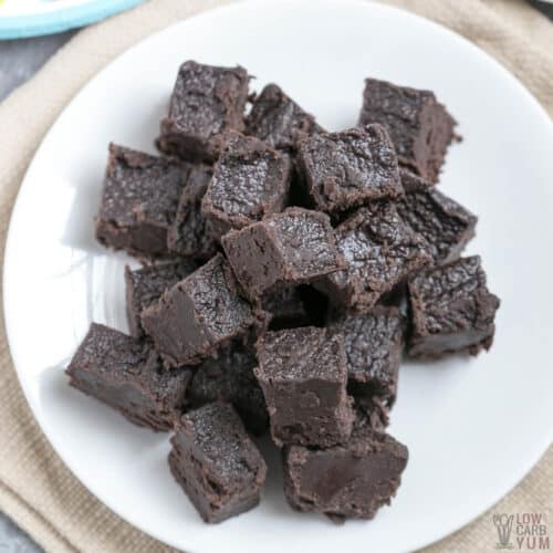 dark chocolate keto fudge squares on white plate3