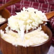 cauliflower rice in wood bowls and spoon