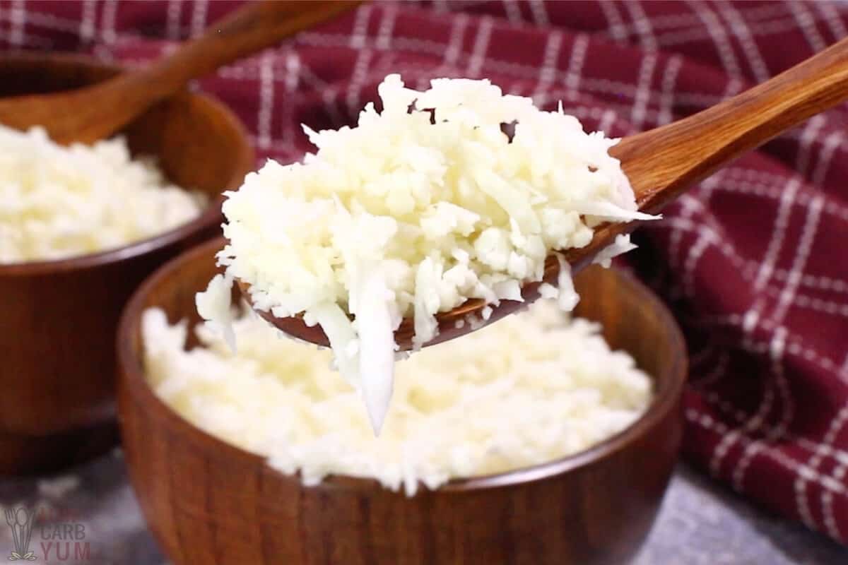 cauliflower rice in wood bowls and spoon