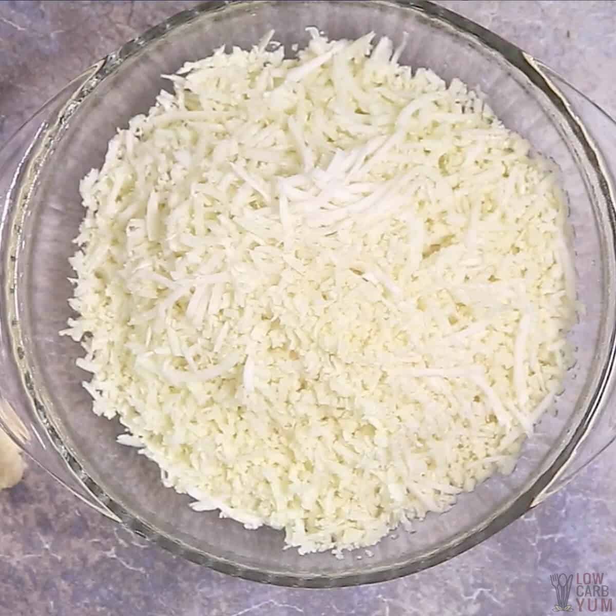 riced cauliflower in microwaveable dish