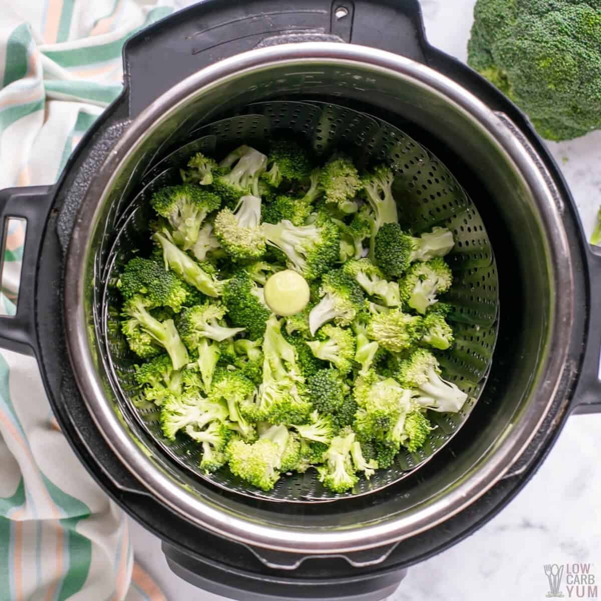 steaming broccoli florets in an electric pressure cooker