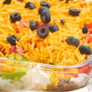 taco dip with meat in casserole pan