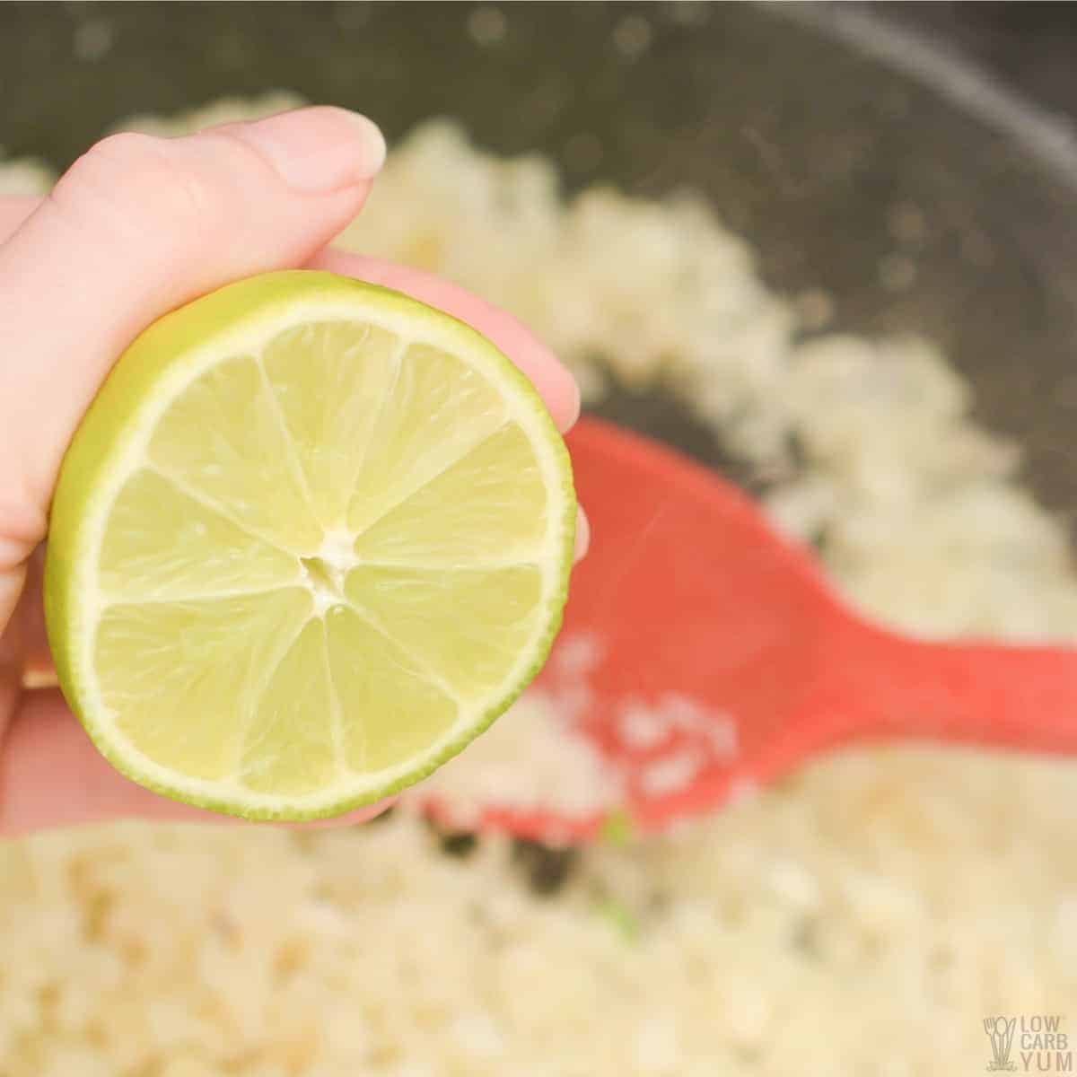 adding lime juice to cauliflower rice in pan