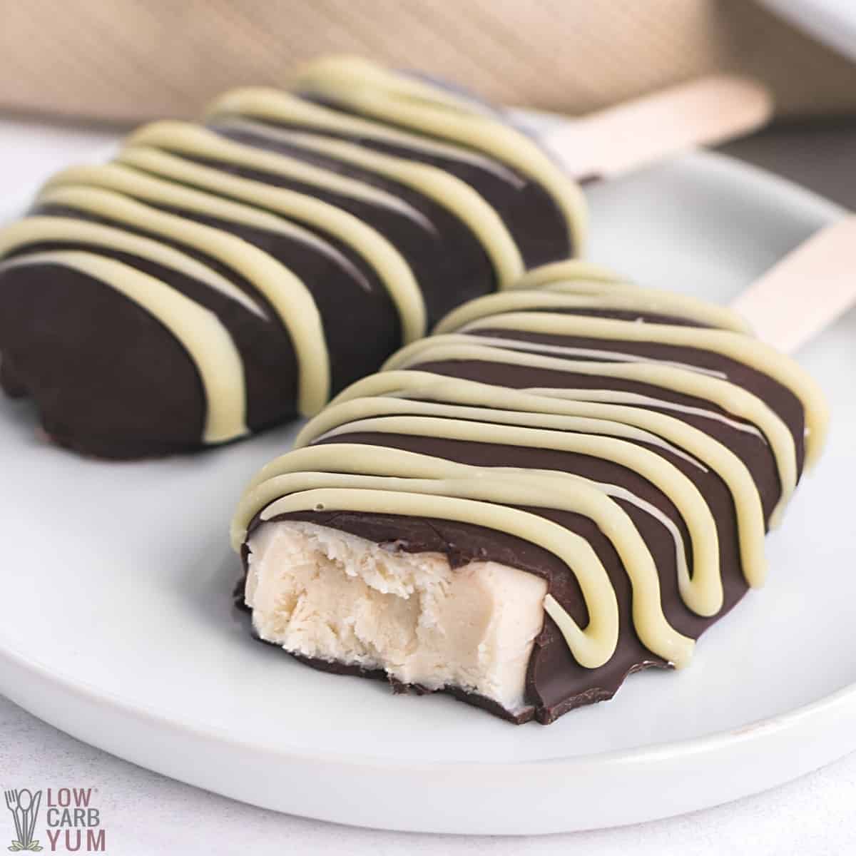 salted caramel ice cream bars on white plate with one bitten