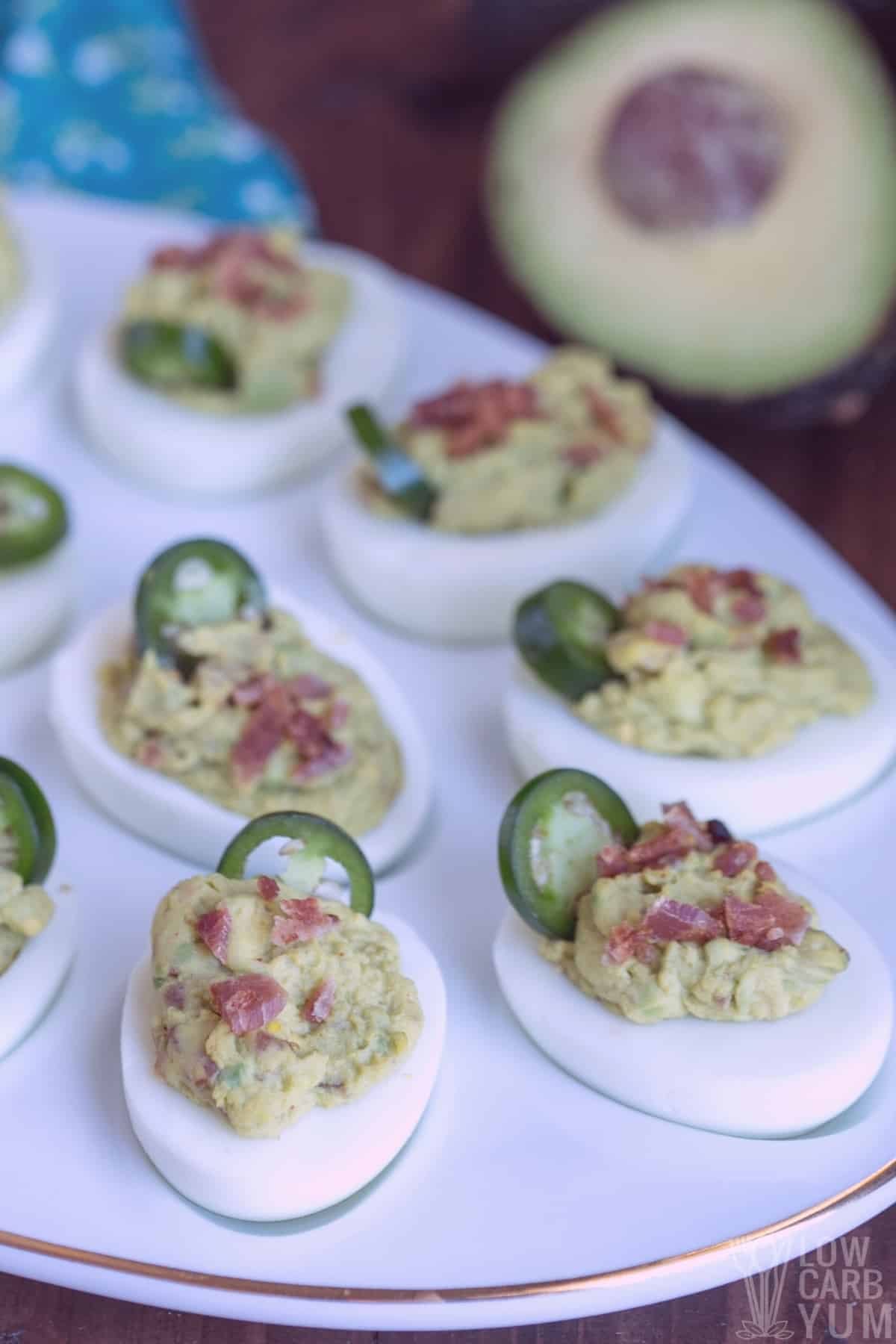 spicy deviled eggs without mayo on white serving plate