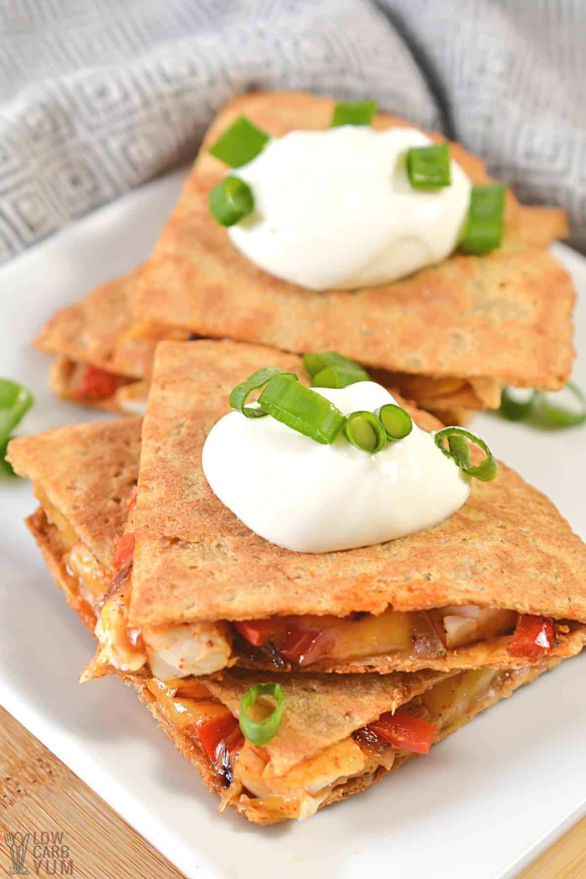 serving air fryer quesadilla on white square plate