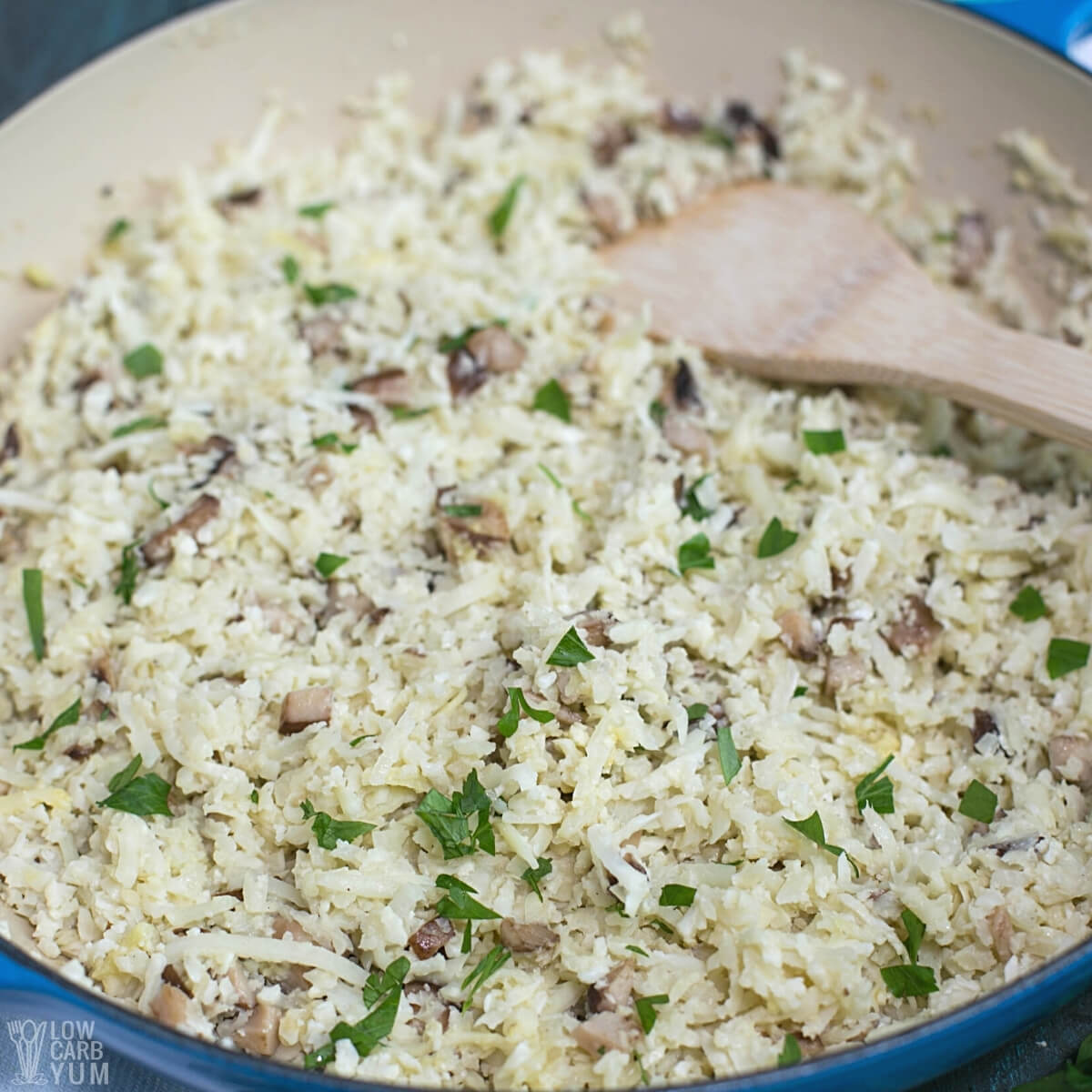 cauliflower rice risotto in pan with wooden spatula