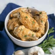 baked garlic parmesan chicken wings in bowl