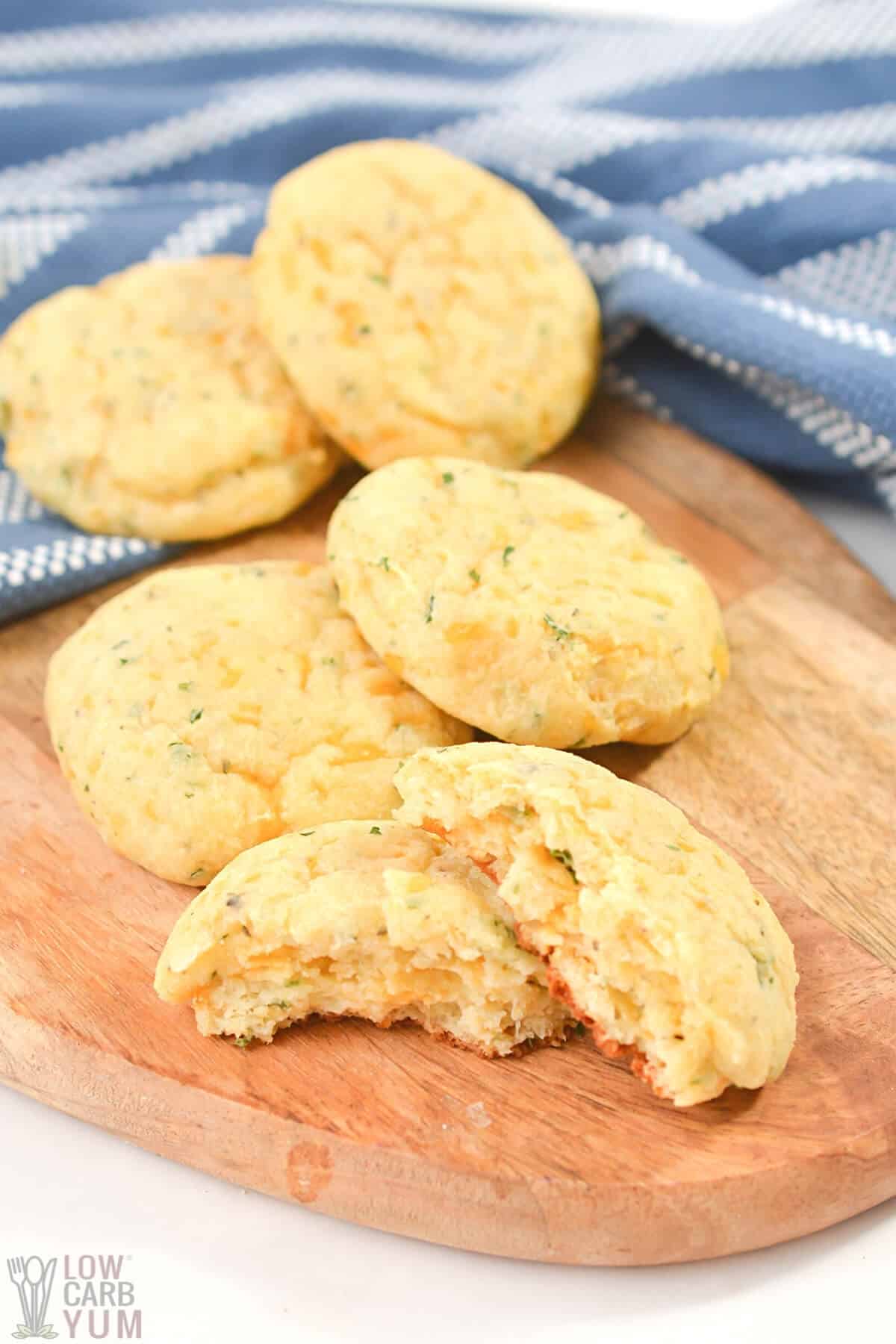 cheese and herb bread rolls on cutting board