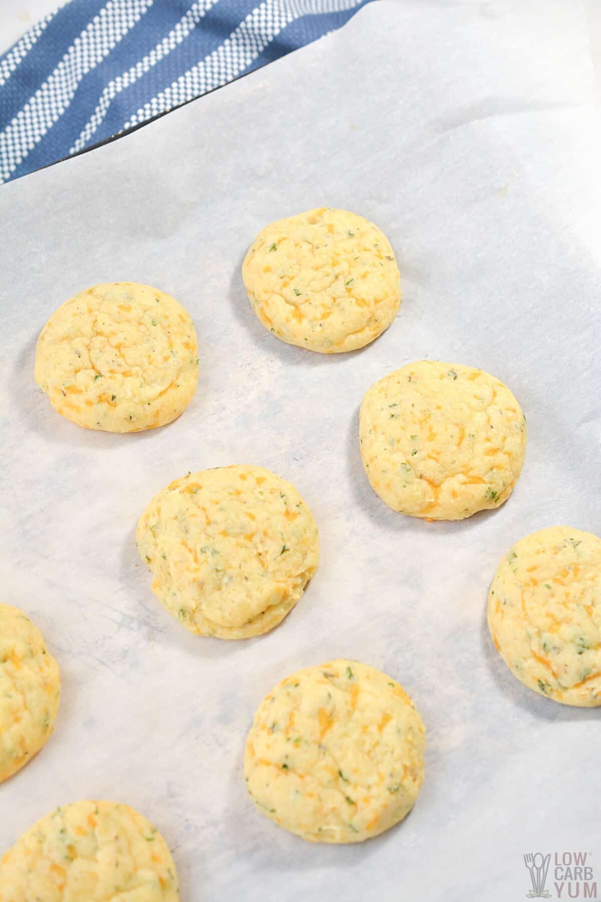 unbaked rolls on parchment paper