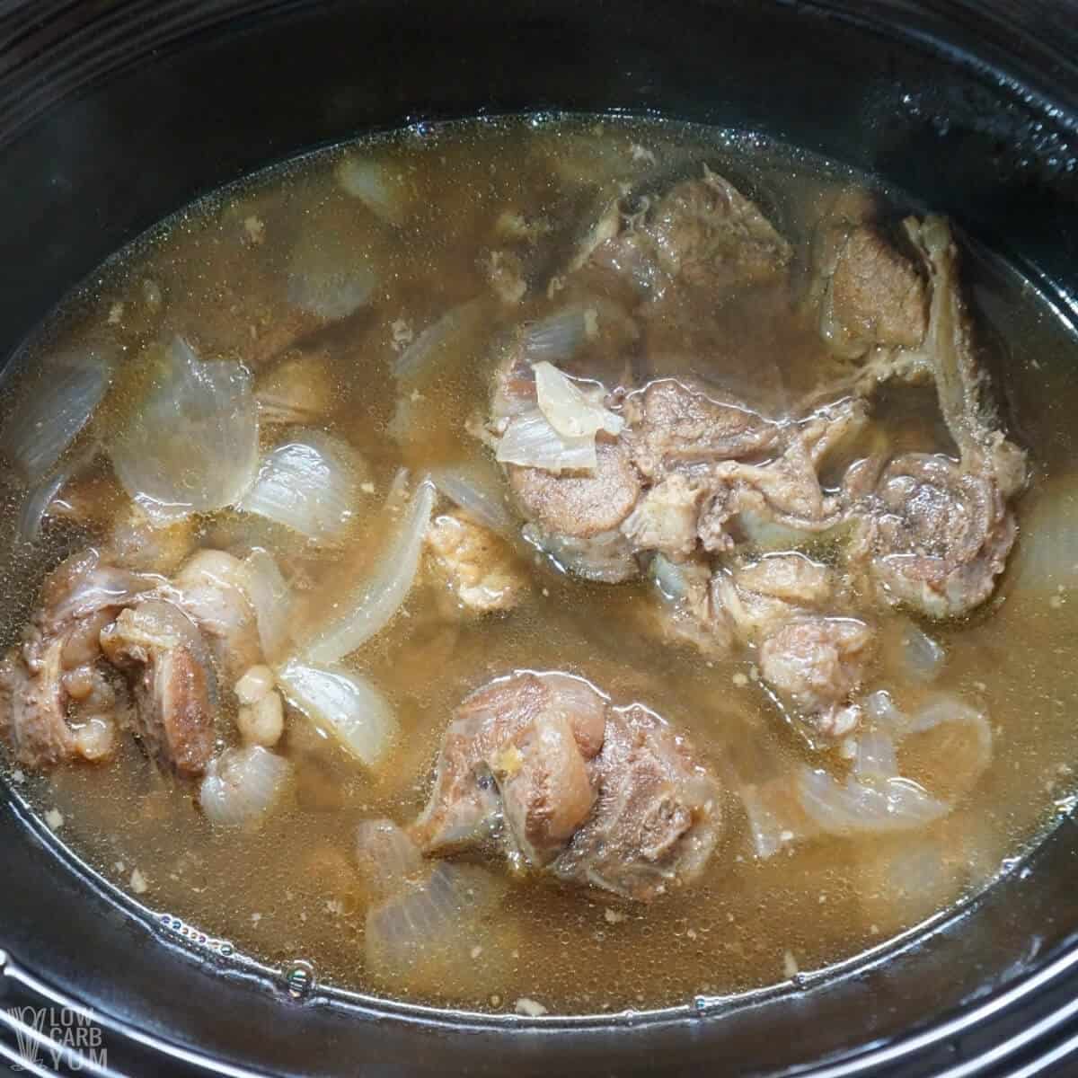cooked beef and onions in crock pot