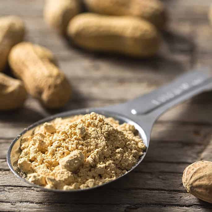 peanut flour in measuring spoon