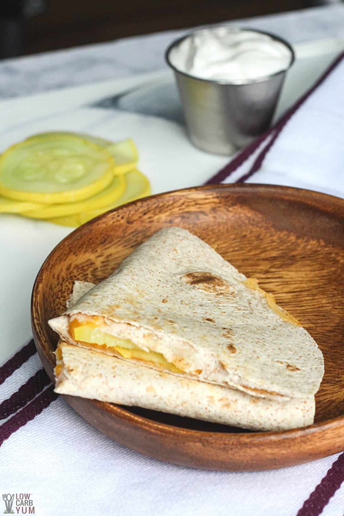 squash cheese quesadilla on wooden plate