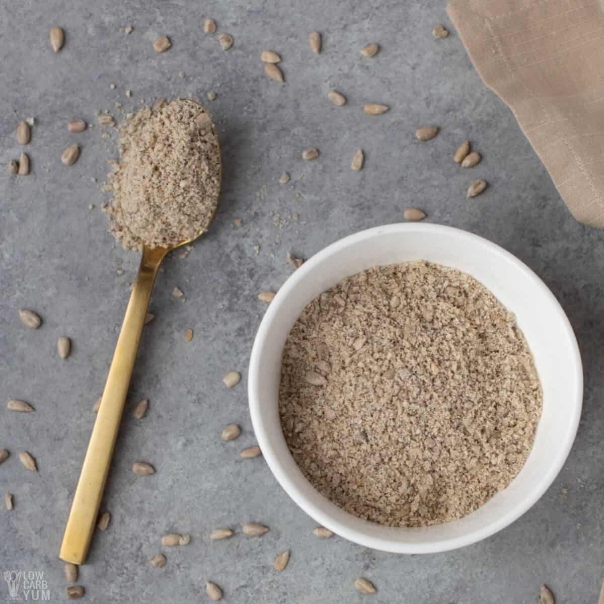 sunflower seed flour in bowl and spoon