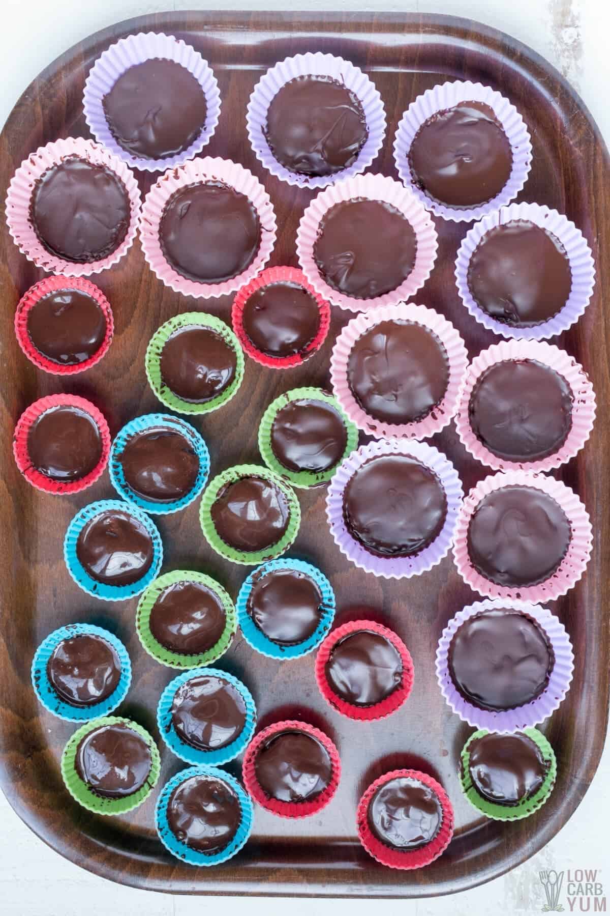 assembled peanut butter cups on dark brown tray
