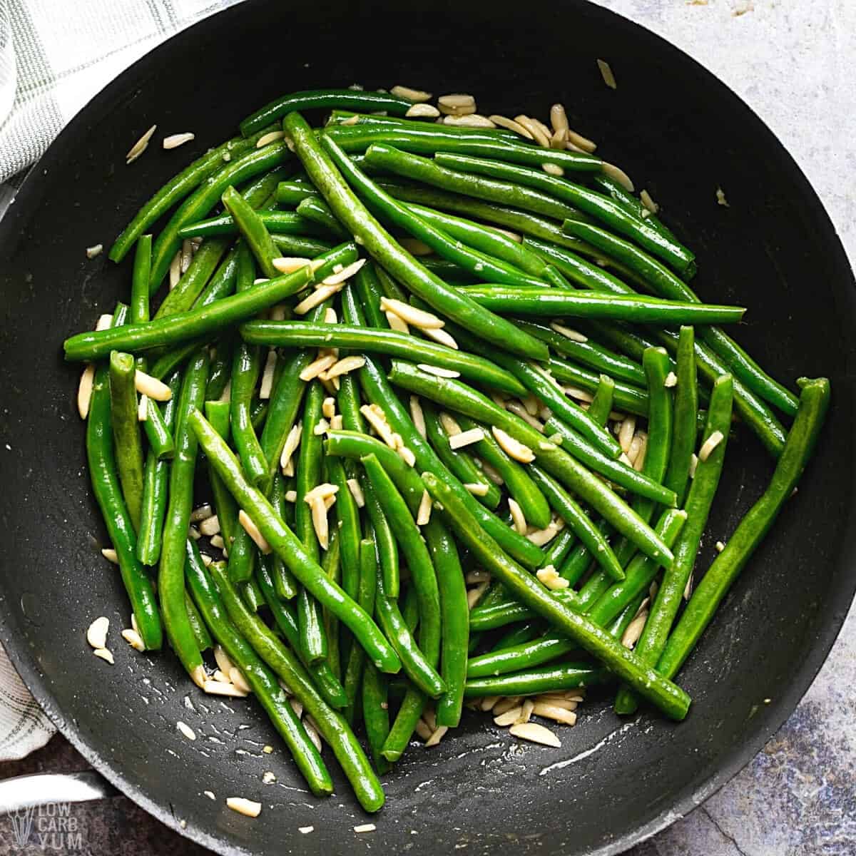 green beans almondine cooked in skillet