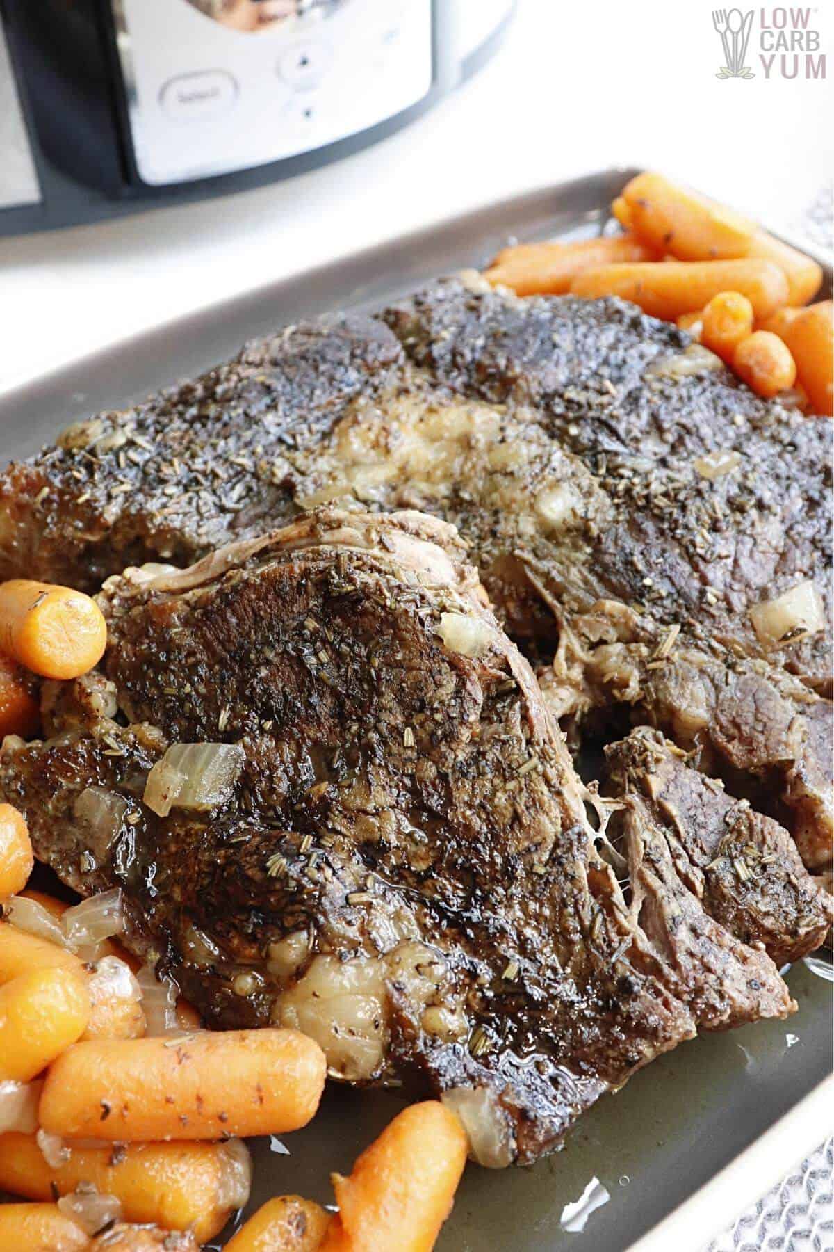 instant pot with pot roast and carrots on sheet pan