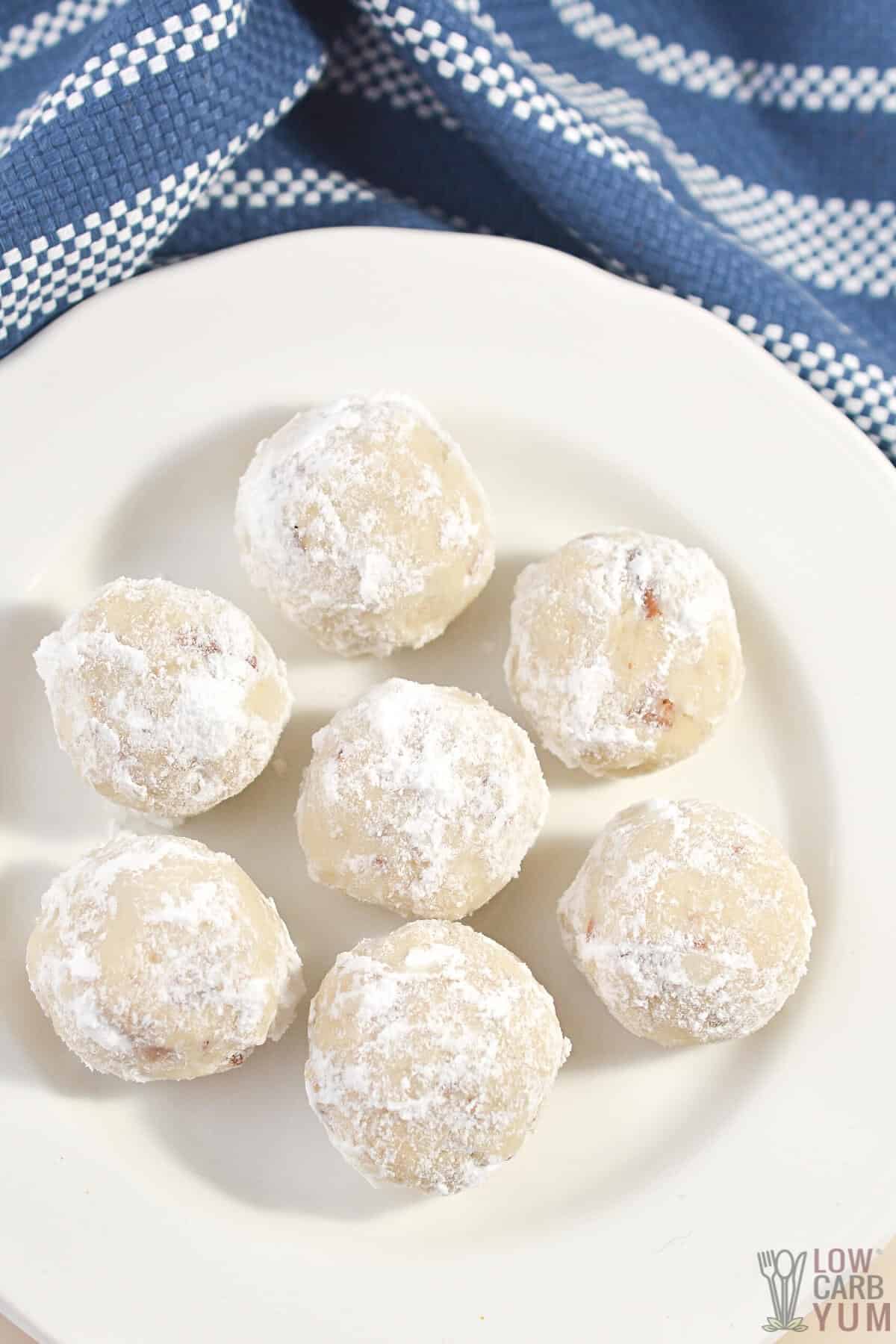 keto snowball cookies on white plate