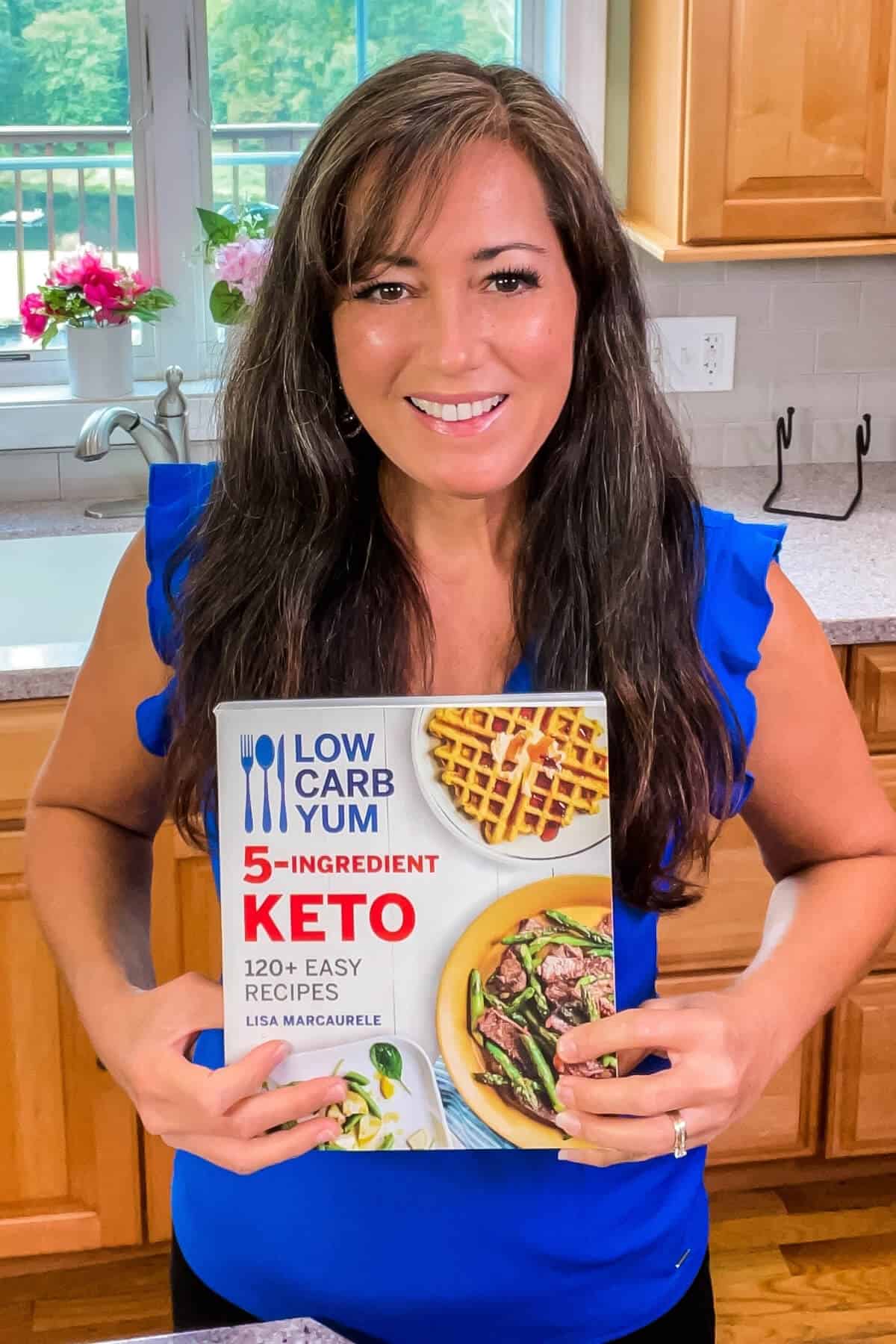 lisa in kitchen with low carb yum 5-ingredient keto cookbook