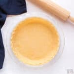 unbaked keto pie crust with rolling pin