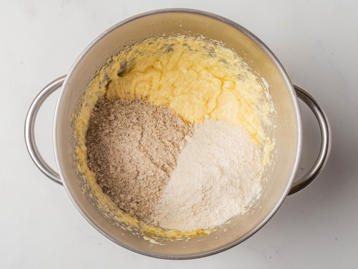 adding dry ingredients to cookie batter